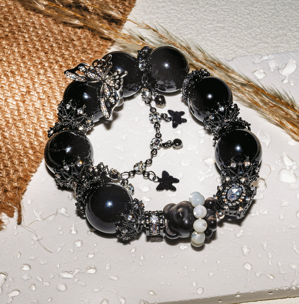 Noir Flutter Teddy Bear —Dark, playful, and quietly tender.