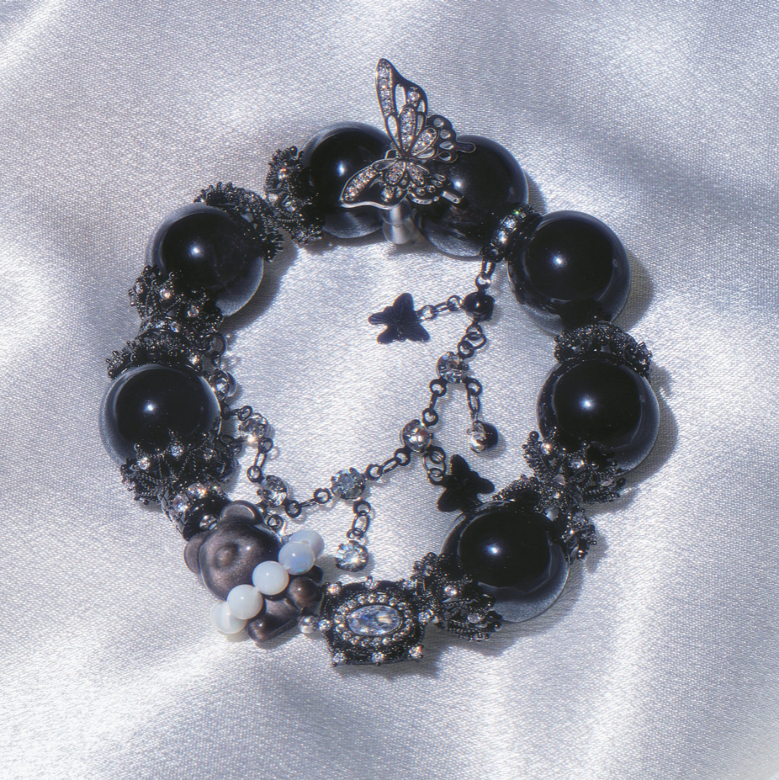 Noir Flutter Teddy Bear —Dark, playful, and quietly tender.