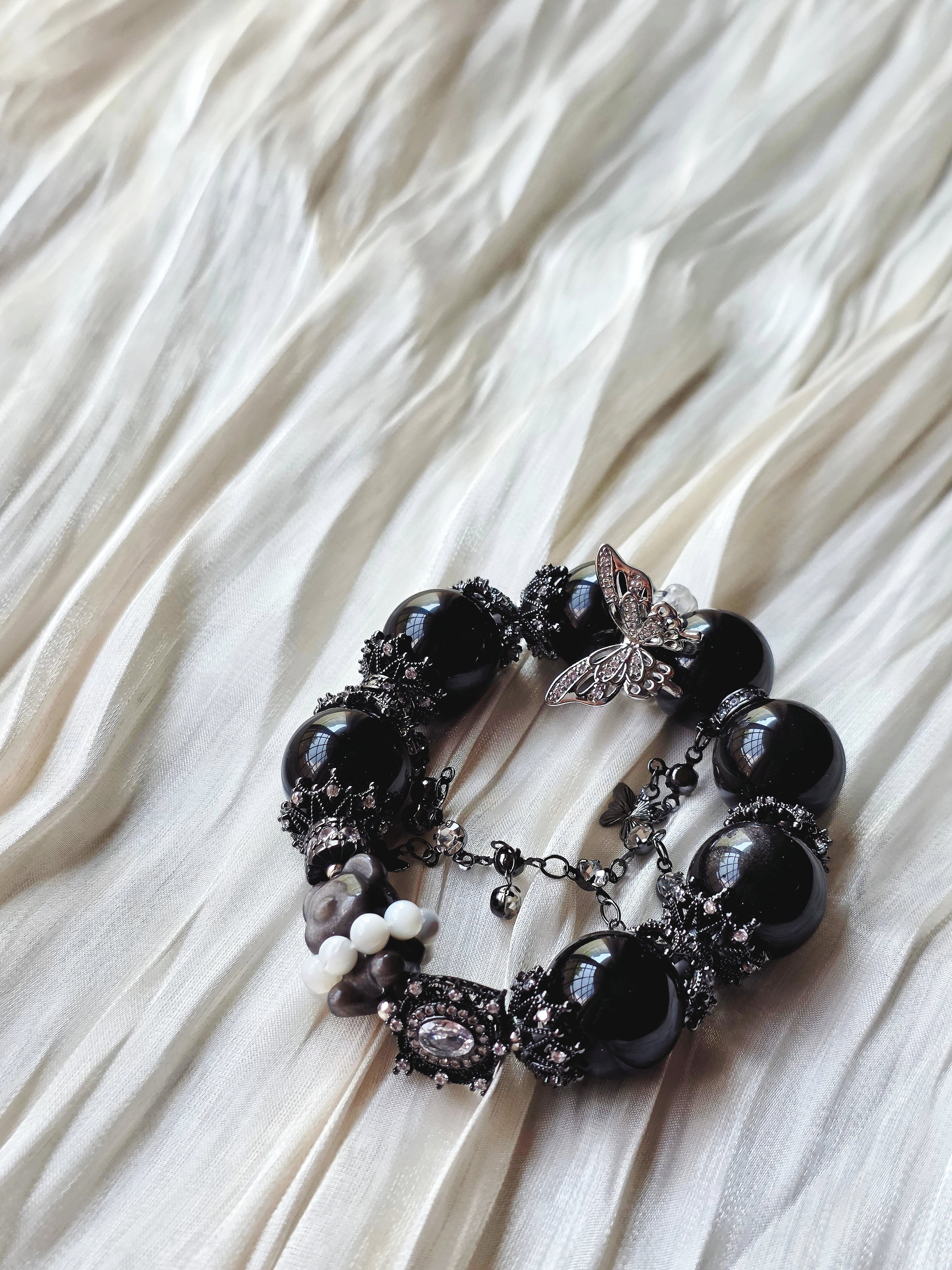 Noir Flutter Teddy Bear —Dark, playful, and quietly tender.